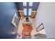 Blue and white high ceiling home office with desk and bookshelves at 6953 Broglie St, Orlando, FL 32827