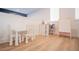 Bright playroom with white furniture, light wood floors, and a art easel at 6953 Broglie St, Orlando, FL 32827