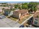 Aerial view of a two-story apartment complex with staircases and assigned parking spaces at 704 Michigan Ct # 4, St Cloud, FL 34769