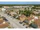 Aerial view showcasing the layout of an apartment complex with ample parking and landscaping at 704 Michigan Ct # 4, St Cloud, FL 34769