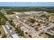 An aerial view showing a well-maintained apartment community surrounded by schools and parks at 704 Michigan Ct # 4, St Cloud, FL 34769