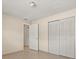 Cozy bedroom featuring tiled floors and a spacious closet with bright lighting at 704 Michigan Ct # 4, St Cloud, FL 34769