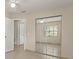 A bedroom featuring a mirrored closet door, ceiling fan, and access to a tiled bathroom at 704 Michigan Ct # 4, St Cloud, FL 34769