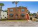 Two-story apartment building with assigned parking spaces and easy access to upper floors at 704 Michigan Ct # 4, St Cloud, FL 34769