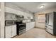 Modern kitchen with stainless steel appliances, ample counter space, and plenty of natural light at 704 Michigan Ct # 4, St Cloud, FL 34769