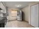Modern kitchen with stainless steel appliances, granite countertops, and ample storage space at 704 Michigan Ct # 4, St Cloud, FL 34769