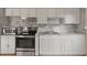 Stylish kitchen featuring stainless steel appliances, sleek countertops, and ample cabinet space at 704 Michigan Ct # 4, St Cloud, FL 34769