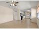 Open-concept living room with tile flooring, ceiling fan, and plenty of natural light at 704 Michigan Ct # 4, St Cloud, FL 34769