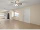 Spacious living area featuring tile floors and neutral wall, seamlessly connected to the kitchen at 704 Michigan Ct # 4, St Cloud, FL 34769