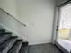 Welcoming entryway with staircase, tiled floor, and a door with blinds offering privacy and light control at 8023 Sayings Dr, Winter Garden, FL 34787
