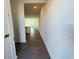 Inviting hallway with stylish, large-format tile flooring leading into the open-concept living area at 8023 Sayings Dr, Winter Garden, FL 34787