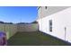 Spacious backyard enclosed by a white fence, offering privacy and room for outdoor activities at 804 Timberland Dr, Eagle Lake, FL 33839