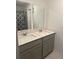 Bathroom with double sinks and modern fixtures, providing ample space at 804 Timberland Dr, Eagle Lake, FL 33839