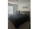 Well-lit bedroom featuring modern decor and comfortable furnishings at 804 Timberland Dr, Eagle Lake, FL 33839