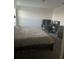 Cozy bedroom features carpeted floors, natural light, and a modern layout at 804 Timberland Dr, Eagle Lake, FL 33839