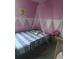 Cute bedroom design with unique decor and an adorable ambiance at 804 Timberland Dr, Eagle Lake, FL 33839