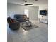 Spacious living room with tile flooring, modern furniture, and a ceiling fan at 804 Timberland Dr, Eagle Lake, FL 33839