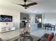 Open-concept living space featuring a kitchen with an island, dining area, and a living room at 804 Timberland Dr, Eagle Lake, FL 33839