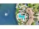 Community amenities include a large pool, lush landscaping, and bocce ball near the lake at 8374 Quimby Cir # 8374, Davenport, FL 33896