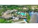 A stunning pool, lakeside recreation, and manicured grounds create a vibrant community at 8374 Quimby Cir # 8374, Davenport, FL 33896