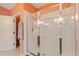 Bright bathroom showcasing a large walk-in shower with clear glass doors and white tiles at 8374 Quimby Cir # 8374, Davenport, FL 33896