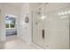 Walk-in shower features sleek glass enclosure, tile surround, and multiple shower heads at 8374 Quimby Cir # 8374, Davenport, FL 33896