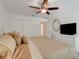 Primary bedroom with a dresser and a ceiling fan at 8374 Quimby Cir # 8374, Davenport, FL 33896