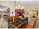 Formal dining room featuring a glass table, decorative chandelier, and stylish buffet at 8374 Quimby Cir # 8374, Davenport, FL 33896