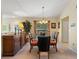Formal dining room featuring a glass table, decorative chandelier, and stylish buffet at 8374 Quimby Cir # 8374, Davenport, FL 33896