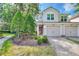 Charming townhome featuring a paved driveway, attached garage, manicured landscaping, and inviting curb appeal at 8374 Quimby Cir # 8374, Davenport, FL 33896