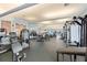 Fully equipped fitness center with modern exercise machines and ample workout space at 8374 Quimby Cir # 8374, Davenport, FL 33896