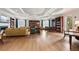 Spacious library featuring built-in bookshelves, cozy seating, and ample lighting at 8374 Quimby Cir # 8374, Davenport, FL 33896