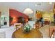 Open concept floorplan with views into the living room and kitchen from the dining area at 8374 Quimby Cir # 8374, Davenport, FL 33896