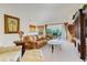 Inviting living room with comfortable sofas, a balcony view, and an elegant entertainment center at 8374 Quimby Cir # 8374, Davenport, FL 33896