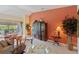 Comfortable living room featuring a large entertainment center and sliding glass doors to the patio at 8374 Quimby Cir # 8374, Davenport, FL 33896