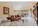 The living room has comfortable seating, and a view of the screened porch at 8374 Quimby Cir # 8374, Davenport, FL 33896