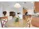 Open living and dining area with views into the kitchen at 8374 Quimby Cir # 8374, Davenport, FL 33896