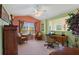 The office has a ceiling fan, large window, and a built-in desk at 8374 Quimby Cir # 8374, Davenport, FL 33896