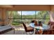 Inviting screened patio featuring a dining area with views of trees and community landscaping at 8374 Quimby Cir # 8374, Davenport, FL 33896