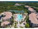 Beautiful aerial view of community featuring a pool, cabanas, gorgeous landscaping and a scenic pond at 8774 Worldquest Blvd # 7503, Orlando, FL 32821