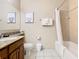 Bright bathroom featuring granite vanity, artwork and a shower-tub combination at 8774 Worldquest Blvd # 7503, Orlando, FL 32821