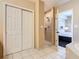 Bathroom with tile flooring, a glass enclosed shower and an entrance leading to a bedroom at 8774 Worldquest Blvd # 7503, Orlando, FL 32821