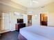 Spacious bedroom featuring a king bed, access to a patio, and convenient access to both a bathroom and a living area at 8774 Worldquest Blvd # 7503, Orlando, FL 32821