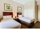 Cozy bedroom with two twin beds, closet, and tasteful decor for a relaxing stay at 8774 Worldquest Blvd # 7503, Orlando, FL 32821