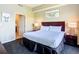Cozy bedroom with comfortable king bed, soft lighting, and stylish decor, conveniently located with an adjacent bathroom at 8774 Worldquest Blvd # 7503, Orlando, FL 32821