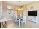 Dining room features an open floor plan and a view of the kitchen at 8774 Worldquest Blvd # 7503, Orlando, FL 32821