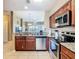 Modern kitchen design with breakfast bar and stainless steel appliances at 8774 Worldquest Blvd # 7503, Orlando, FL 32821