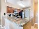 Modern kitchen featuring granite countertops and stainless steel appliances at 8774 Worldquest Blvd # 7503, Orlando, FL 32821