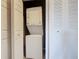 Convenient laundry area with a stacked washer and dryer for in-unit laundry at 8774 Worldquest Blvd # 7503, Orlando, FL 32821