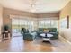 Inviting living room with comfortable seating and access to the lanai at 8774 Worldquest Blvd # 7503, Orlando, FL 32821